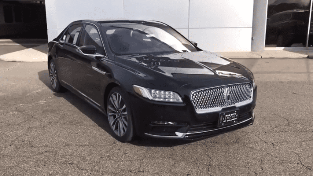Luxury Lincoln Sedan parked outside Newark Airport garage